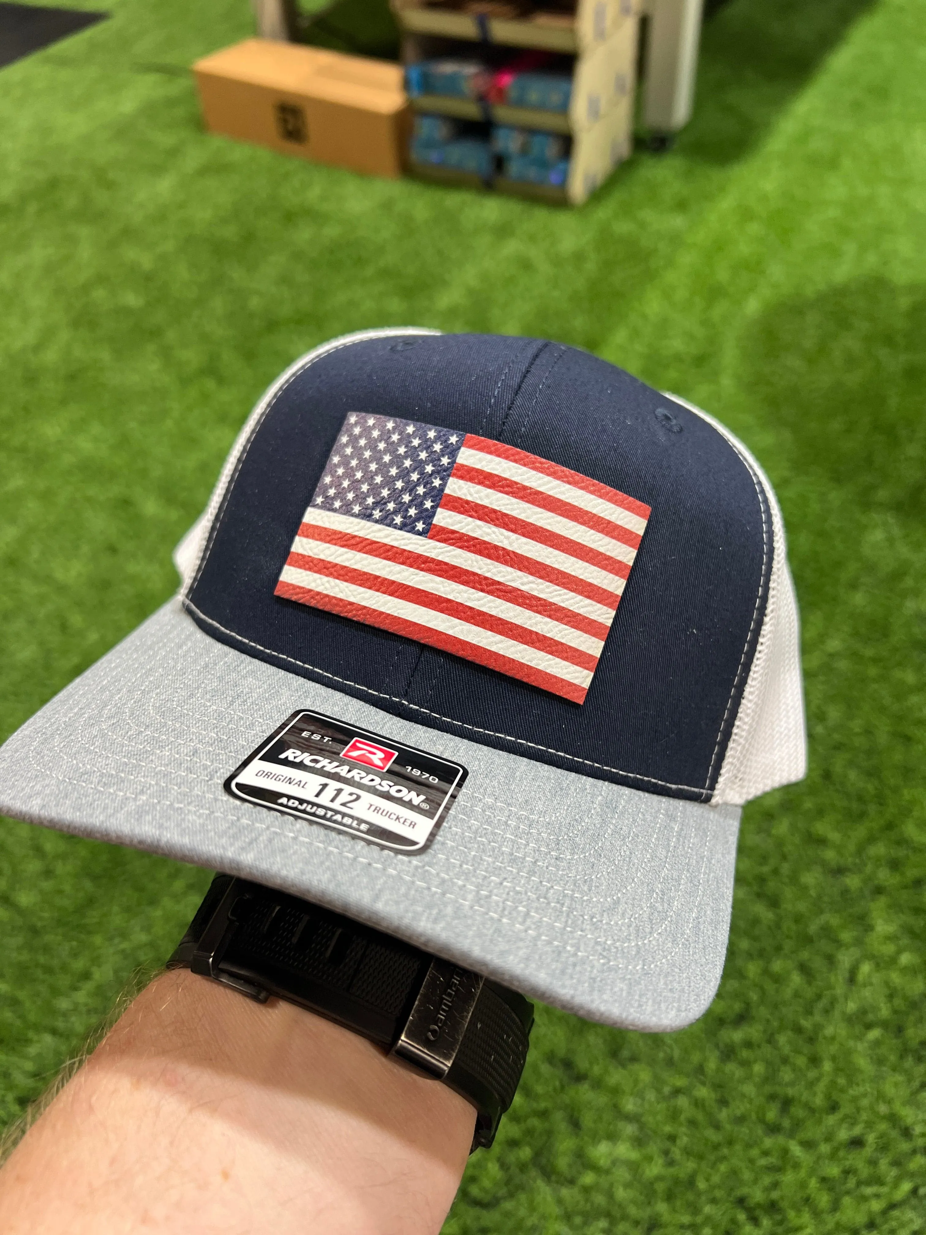 American Flag Hat UV Printed Premium Leatherette Patch on a Richardson 112 Trucker Hat.