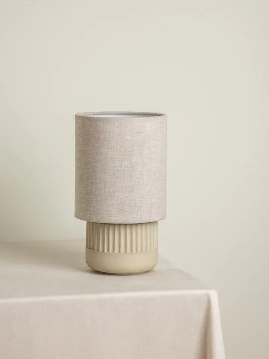 Enza - warm white ribbed concrete table lamp