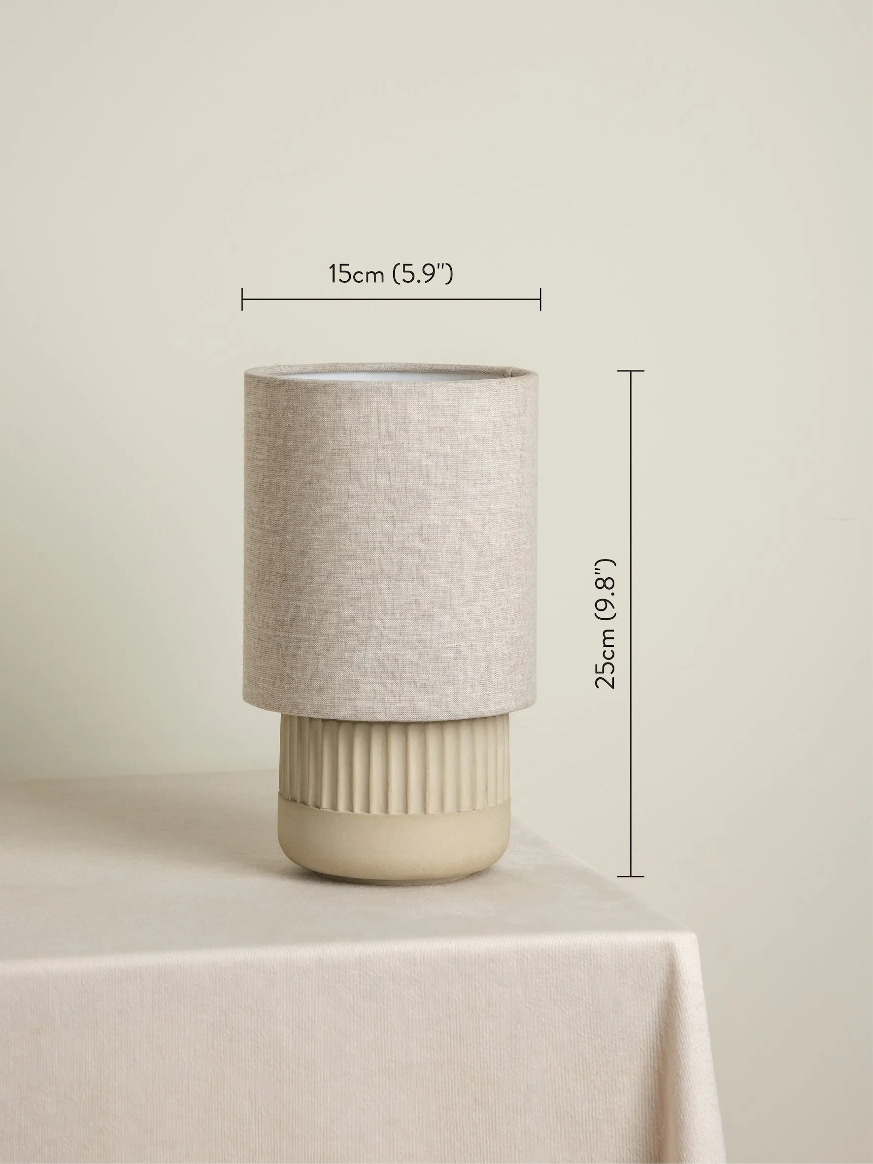 Enza - warm white ribbed concrete table lamp